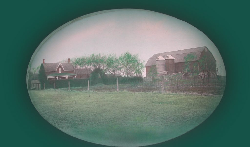 A farm house and barn in the 1950s