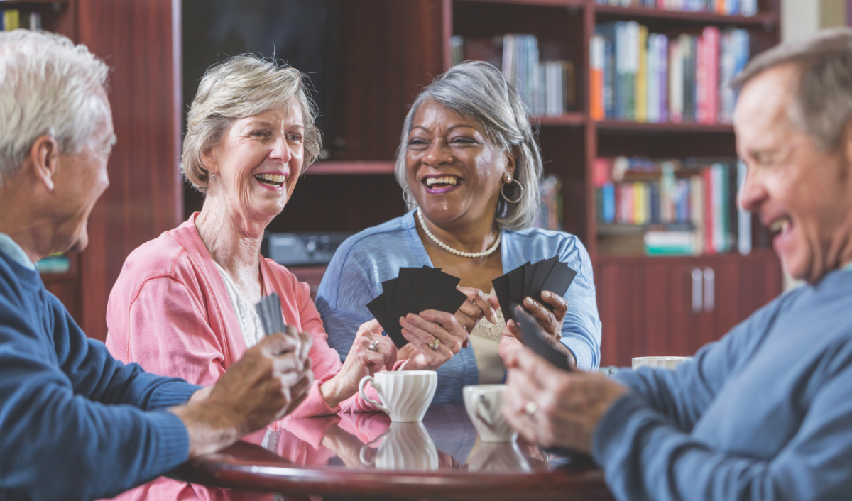 Group of seniors playing cards