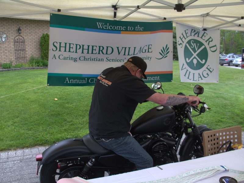 Shepherd Village booth with motorcyclist