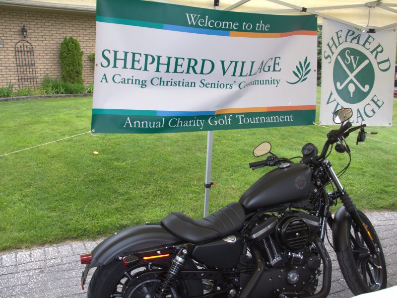 Shepherd Village booth with motorcycle
