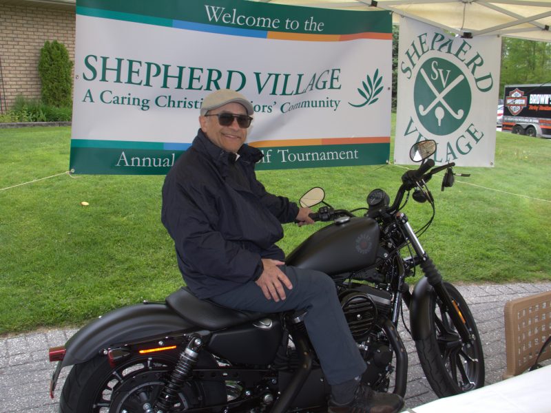 Shepherd Village booth with motorcyclist