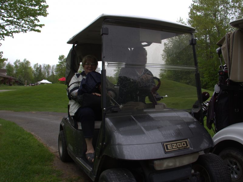 Golfers in golf cart